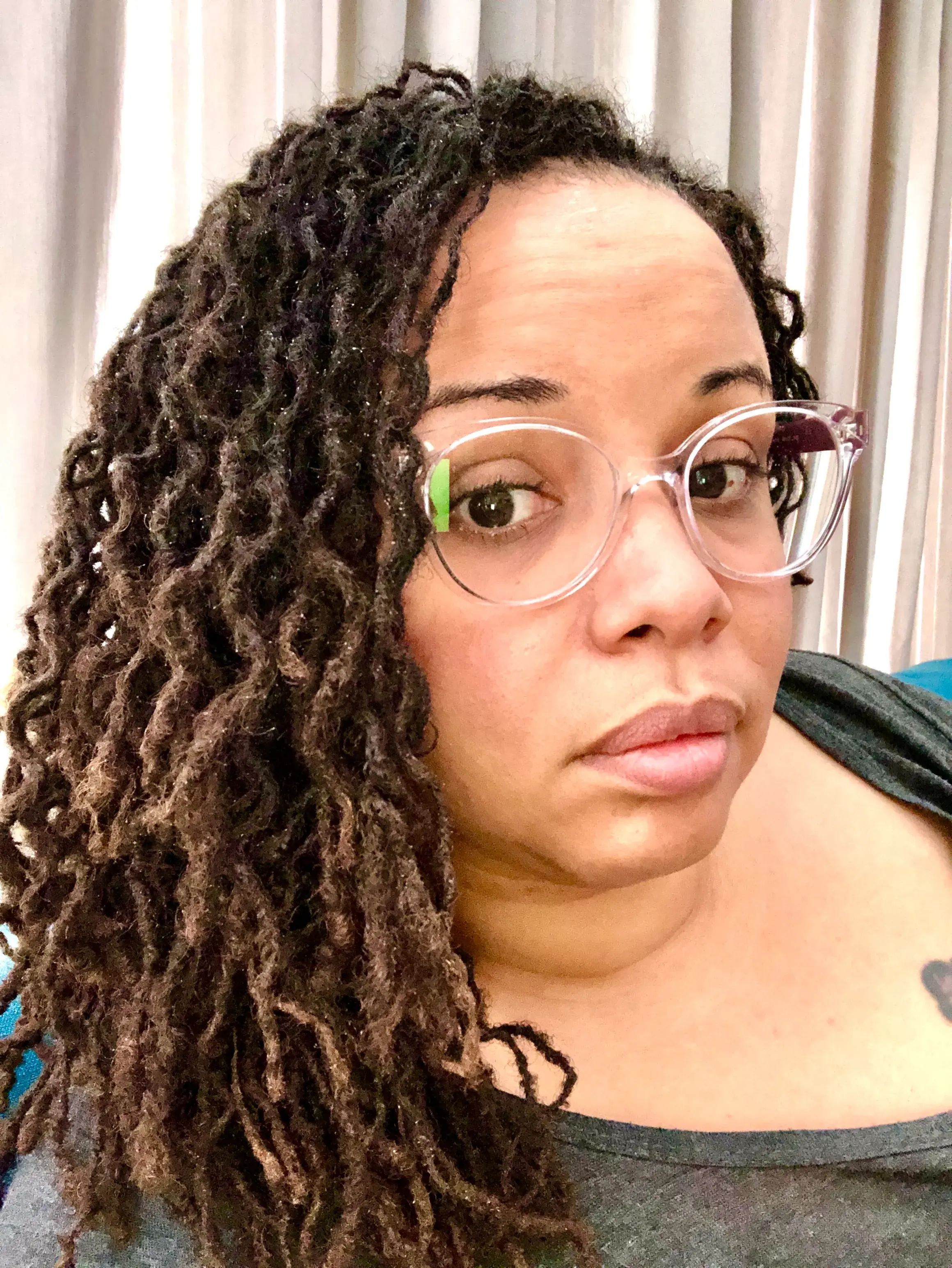 Long flowing mature locs with honey-brown tones — full maturation